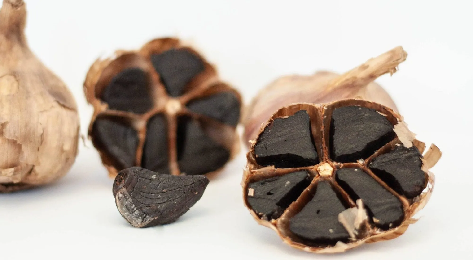 Kipp black garlic: halved bulbs with soft black cloves