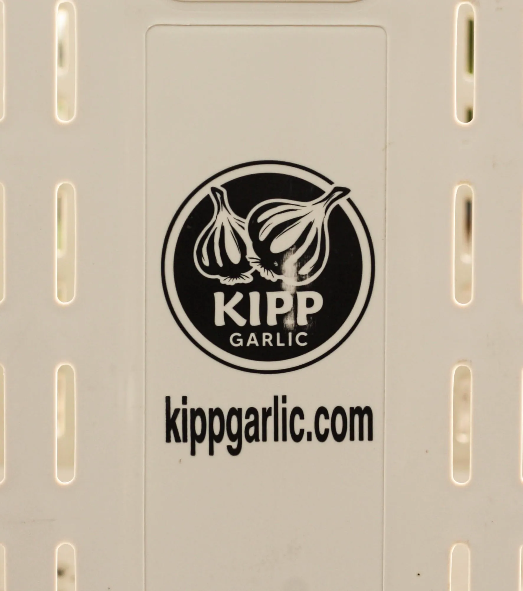 A Kipp Garlic shipping crate with the Kipp Garlic logo